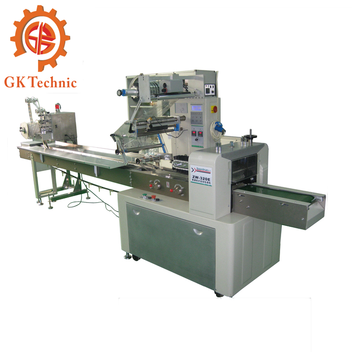 給人人帶來的配角不是巧克力，而是如下這款GK型號的巧克力反轉(zhuǎn)展轉(zhuǎn)式枕式包裝機。